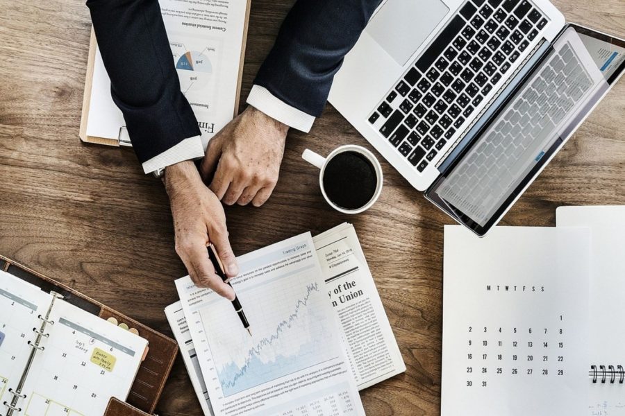 picture of a business man showing a chart